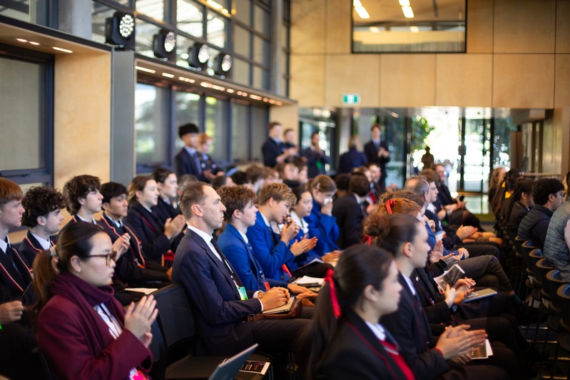 Students and teachers in the audience applauding during a session at the NBCS summit.